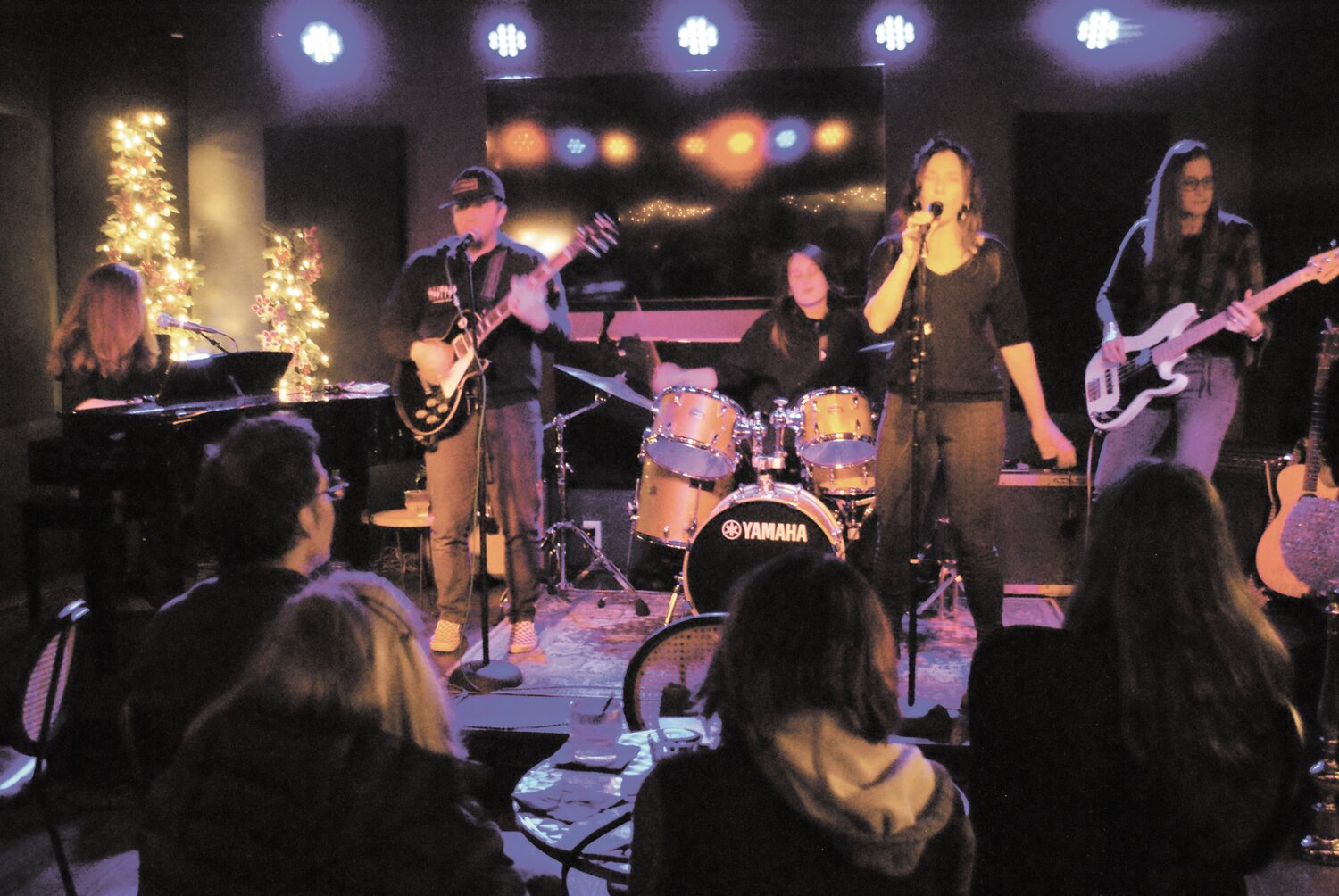 THE BAND CAME TO TOWN: Still House was among the full bands who performed at the open mic. From left to right, Ell Gurney on piano, Sean Rogan on guitar, Olga Gervasi on drums, Selene Byron on vocals, and Andrea Degos on bass. (Photos by Steve Popiel)